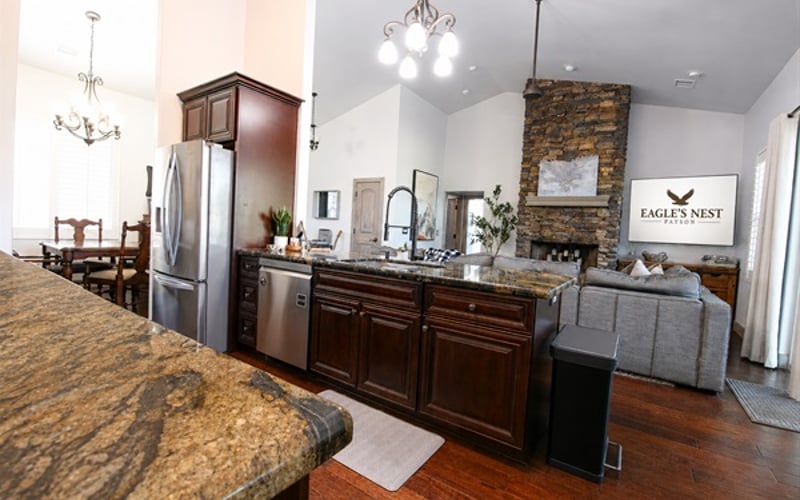 Entertain and unwind with ease in this open living space featuring a spacious kitchen, lounge space with LoveSac couch, and adjoining game room